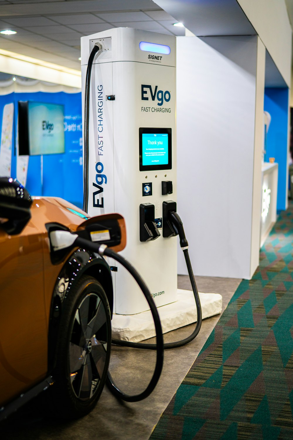 a close up of a car at a charging station