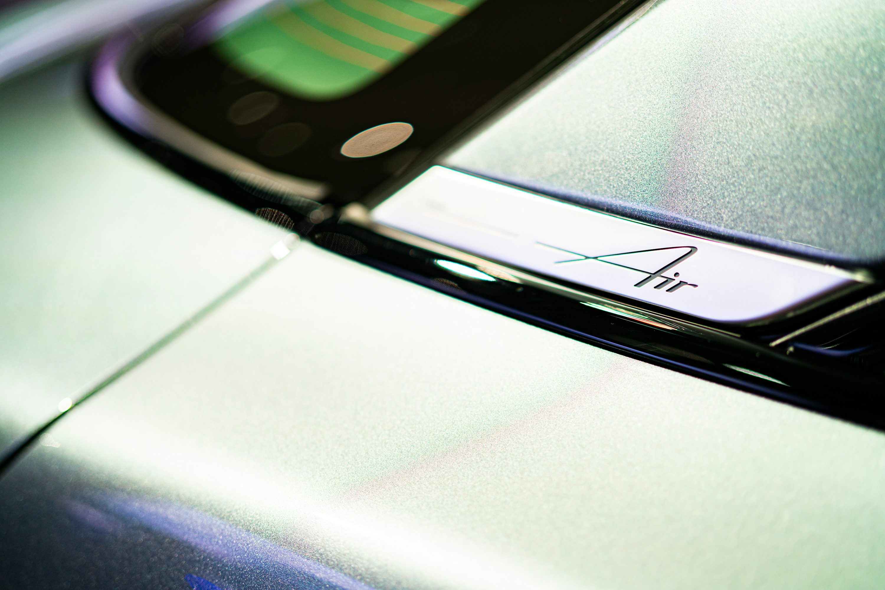 a close up of a cell phone on a car