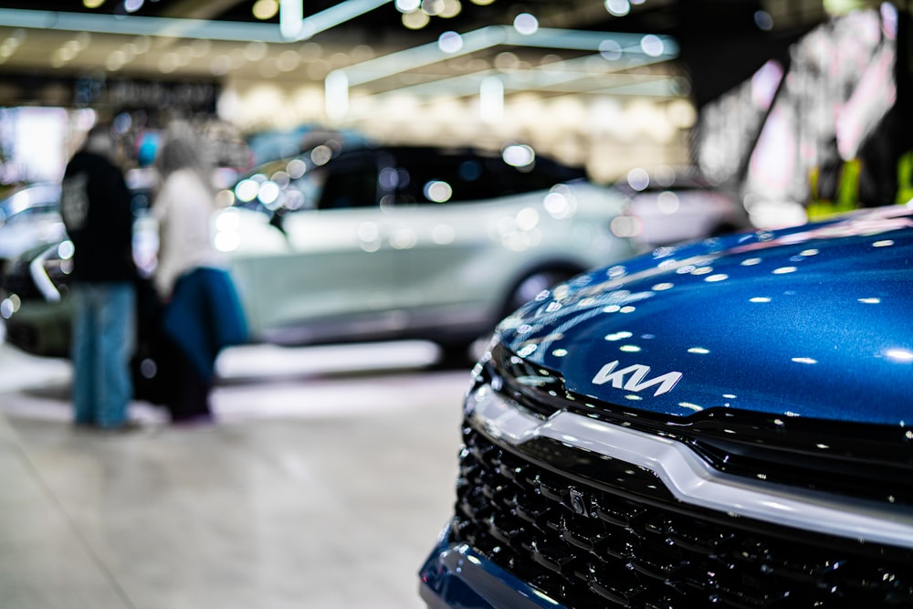 a close up of a car on display at a car show