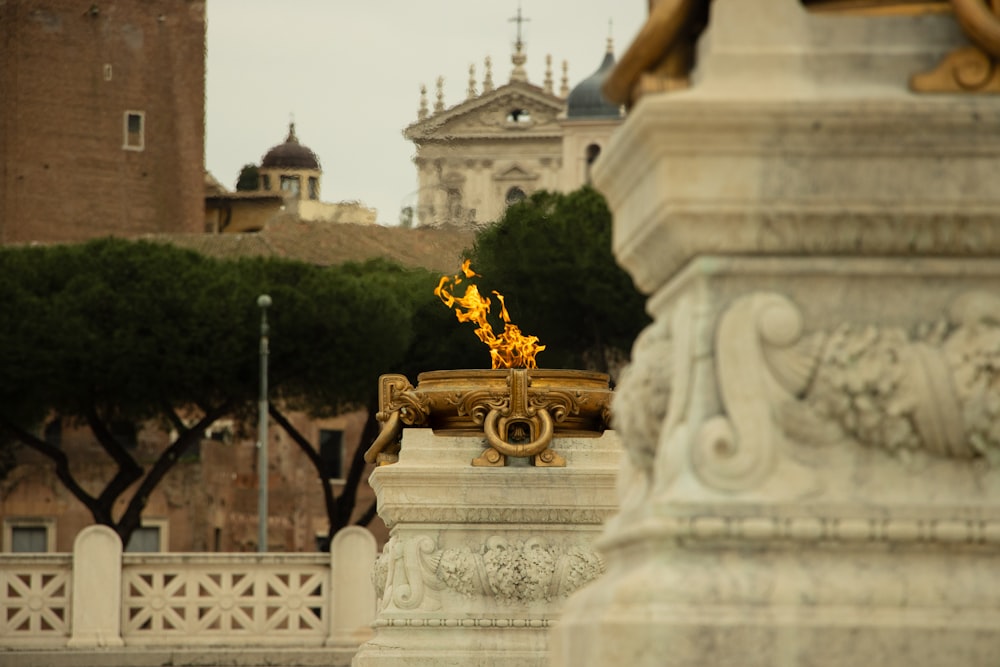 a statue of a man with a fire in his hand