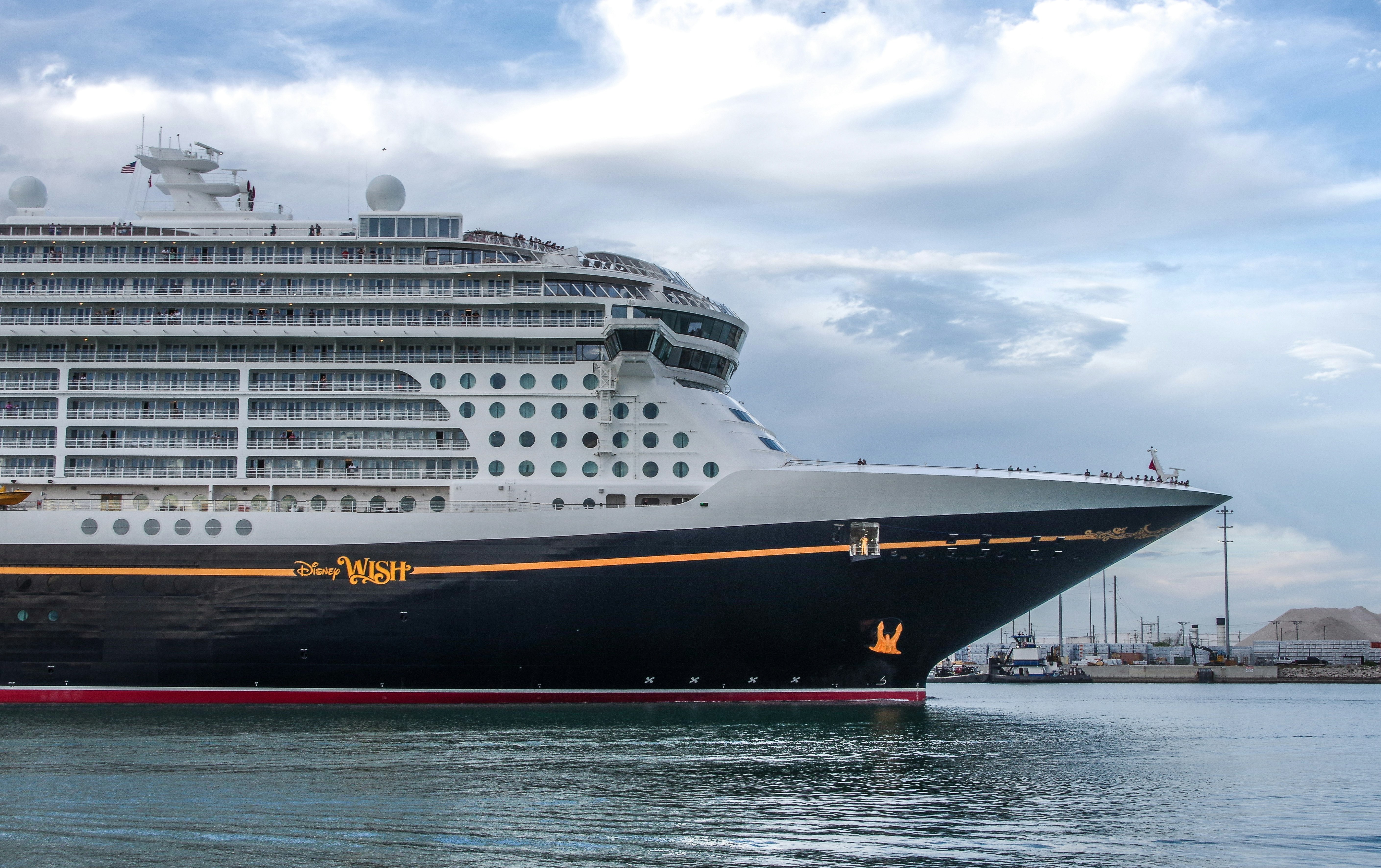 a large cruise ship in a body of water, The Disney "Wish" cruise ship at Port Canaveral, Florida, January 2024.