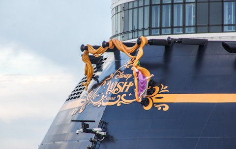 a large cruise ship with a sign on the side of it