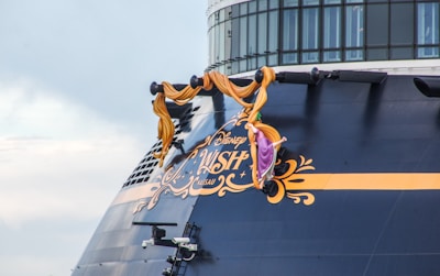 a large cruise ship with a sign on the side of it