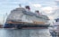 a large cruise ship docked at a dock