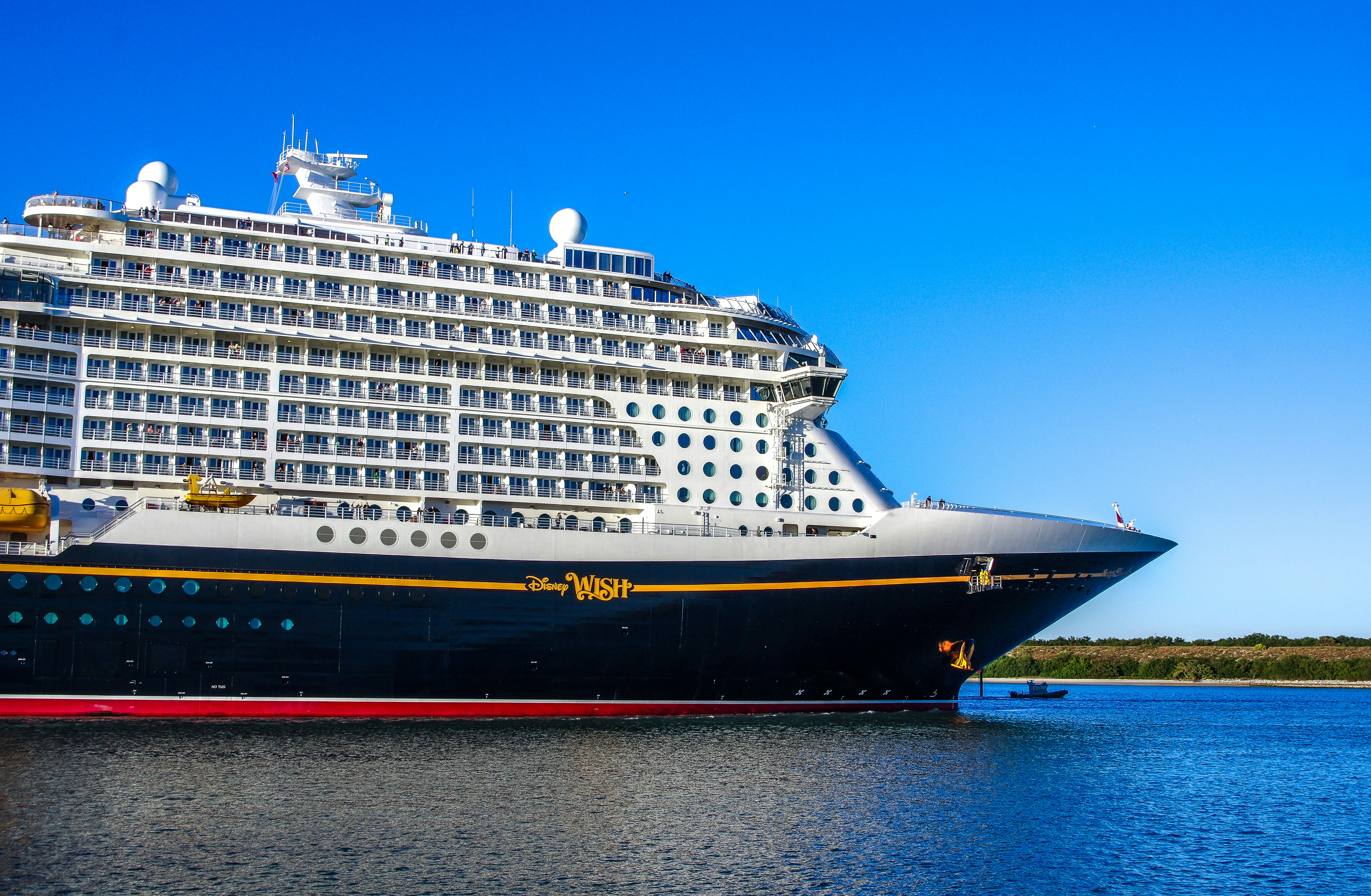 a large cruise ship in a body of water, The Disney "Wish" cruise ship at Port Canaveral, Florida, January 2024.