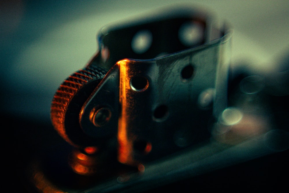 a close up of a metal object with a blurry background