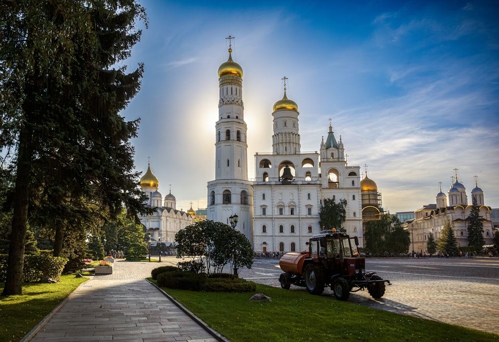 a tractor is parked in front of a church