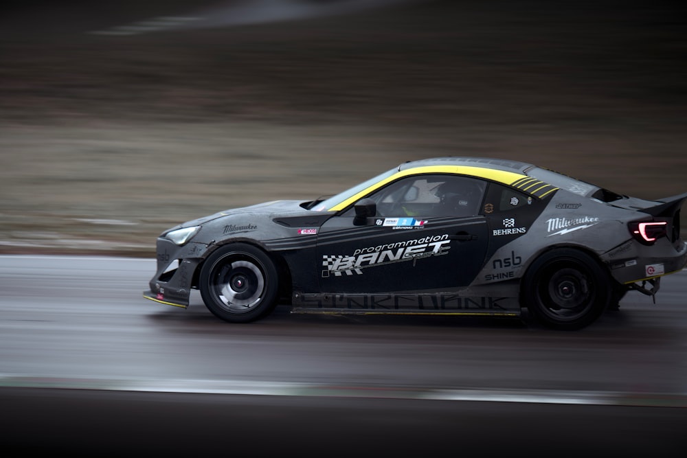 a car driving on a race track during the day