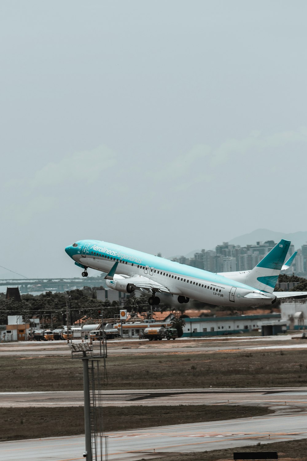 a large jetliner taking off from an airport runway