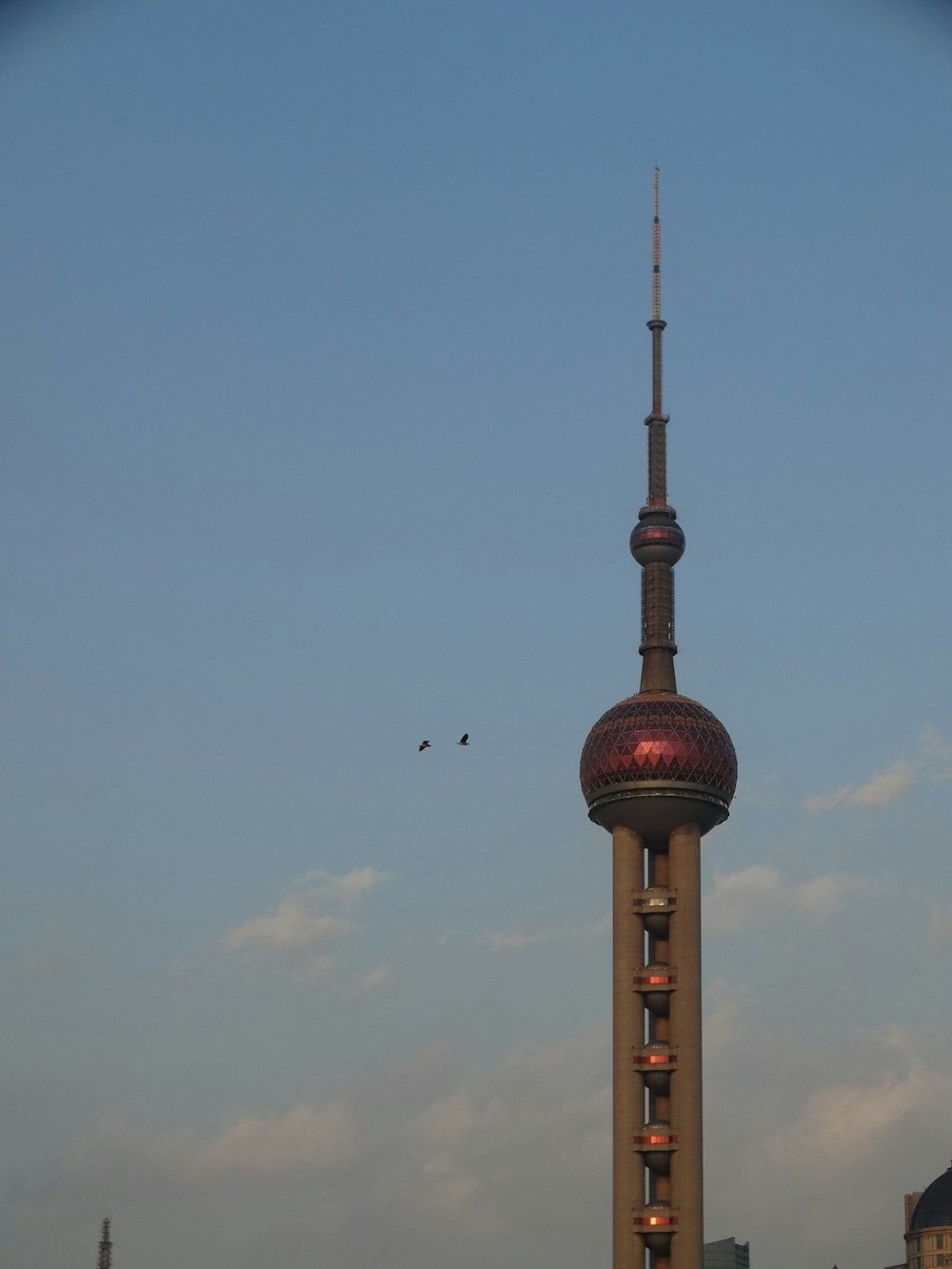 a very tall tower with a clock on it's side