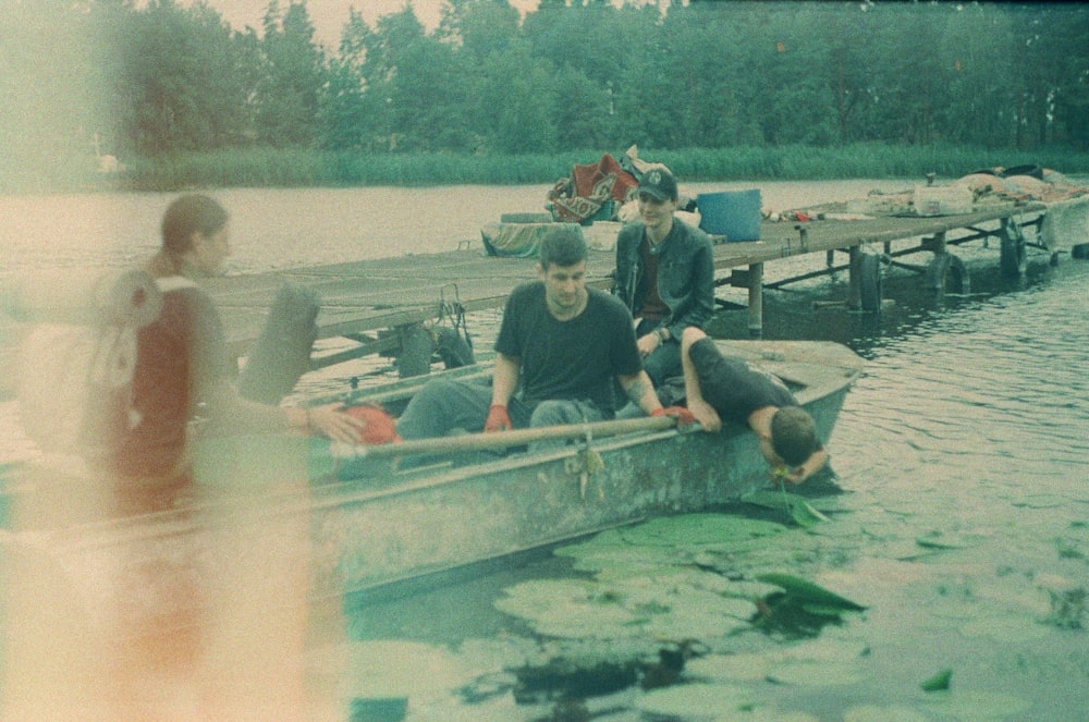 a group of people on a boat in the water