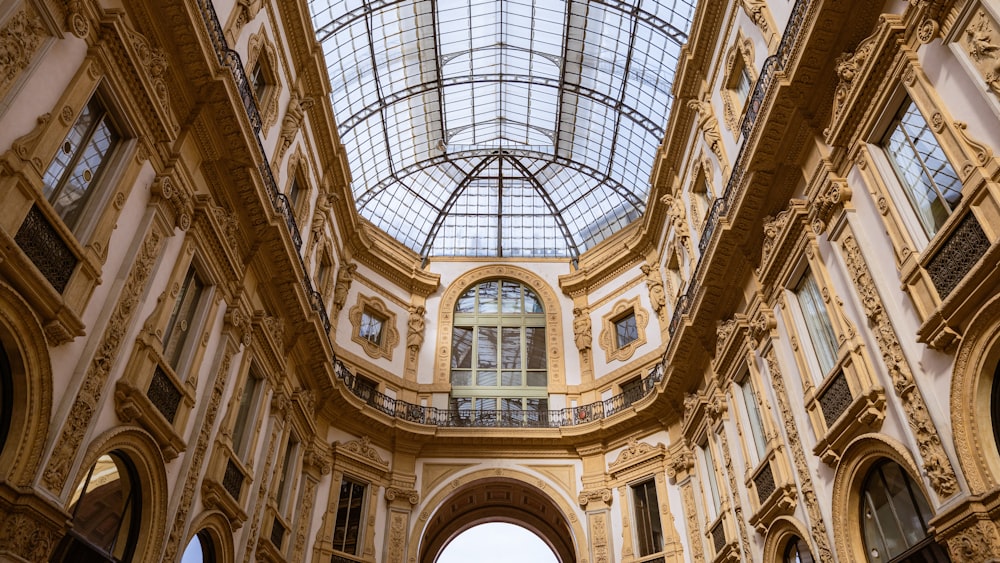 a large building with a glass ceiling and arched windows