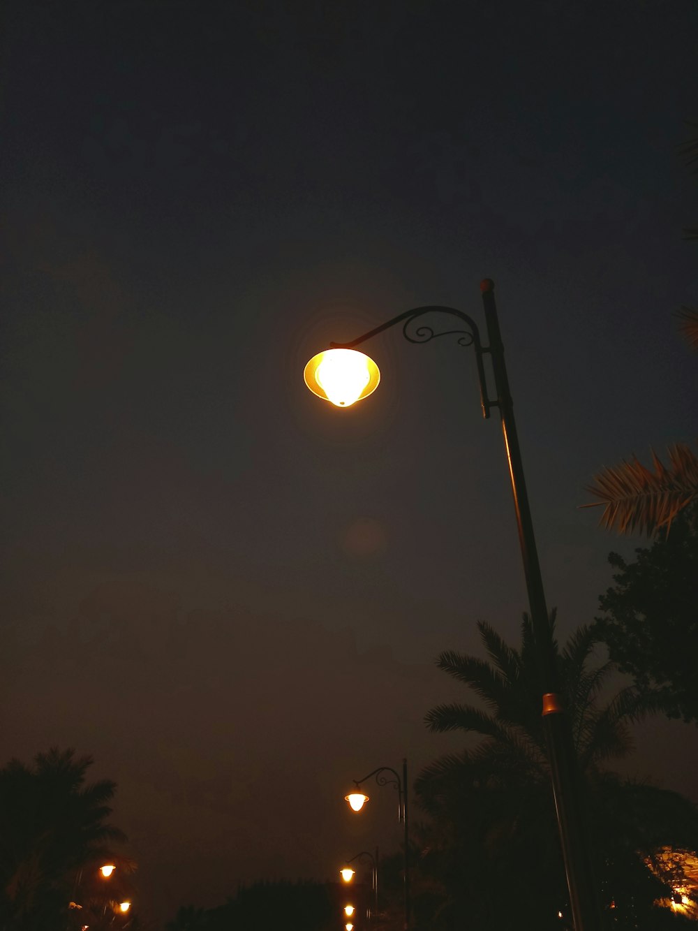 a street light is lit up at night