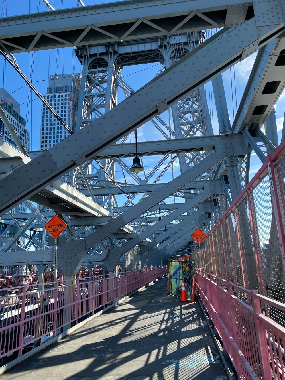 a bridge that has a bunch of people walking on it