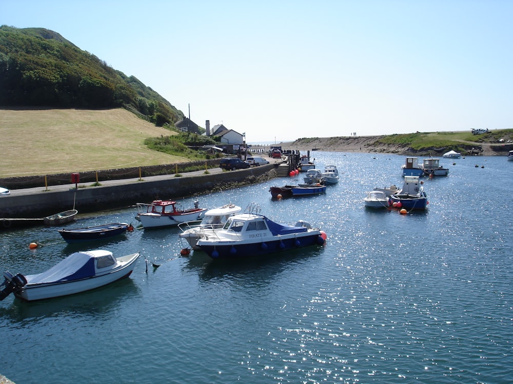 a group of boats floating on top of a river