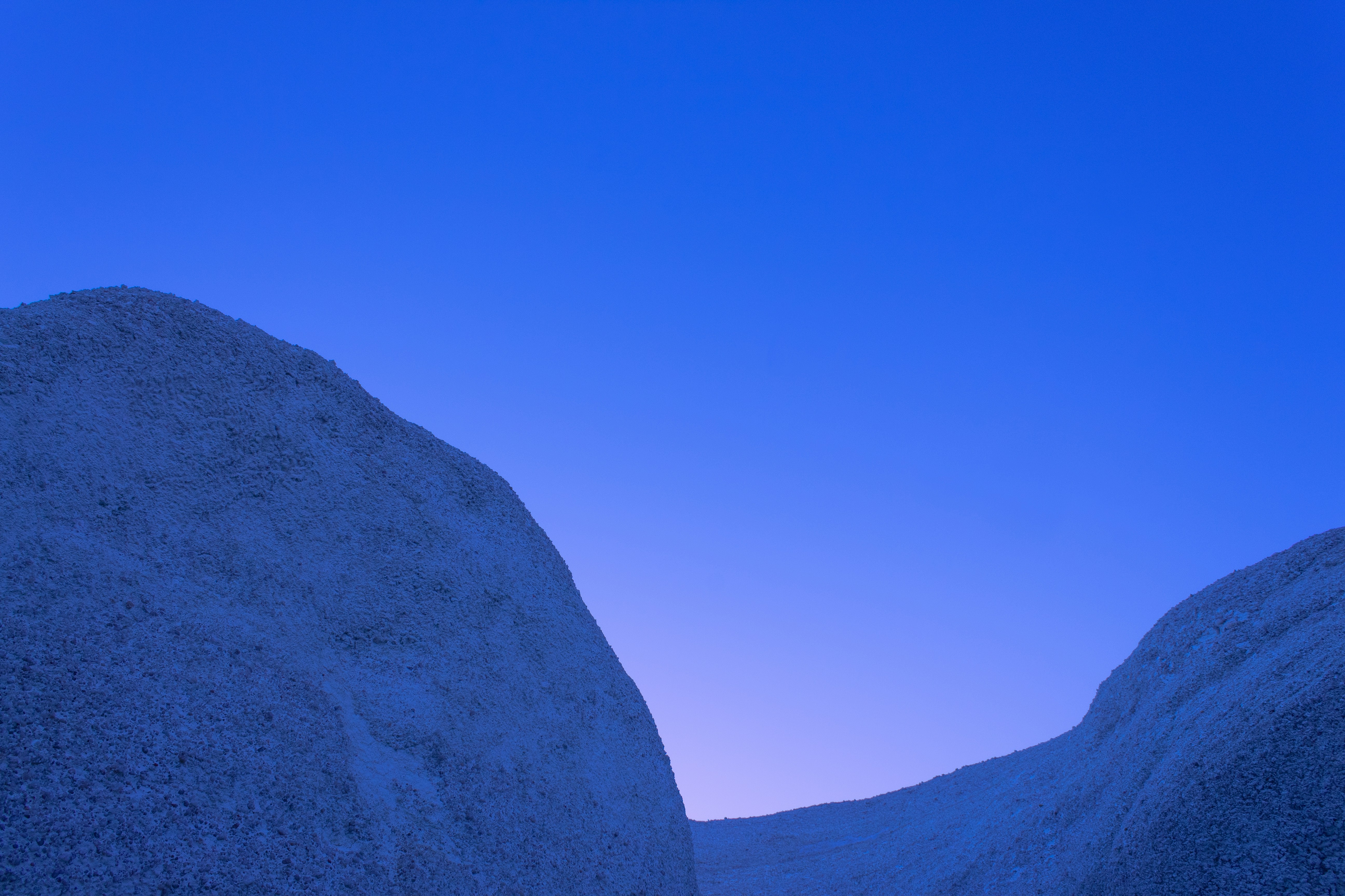a couple of large rocks sitting next to each other