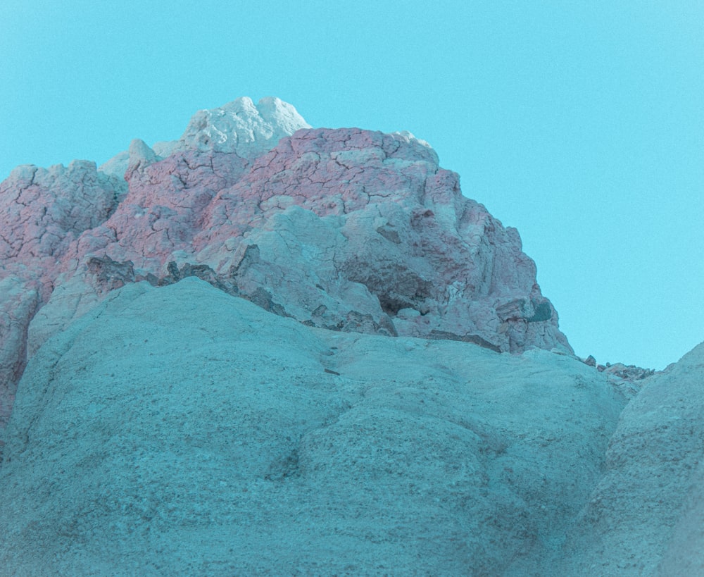 a large mountain with a snow covered peak