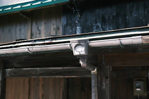 a close up of a metal pipe on a building