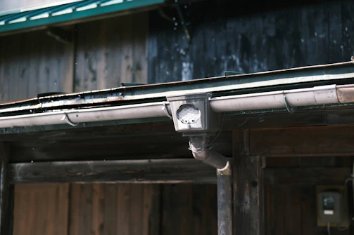 a close up of a metal pipe on a building
