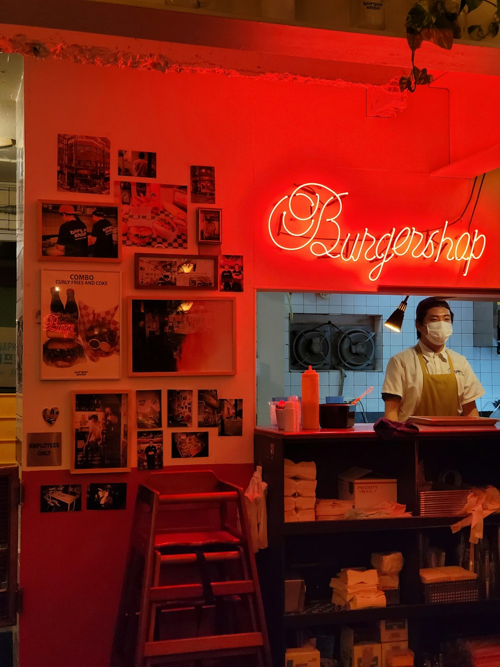 a person behind a counter in a restaurant