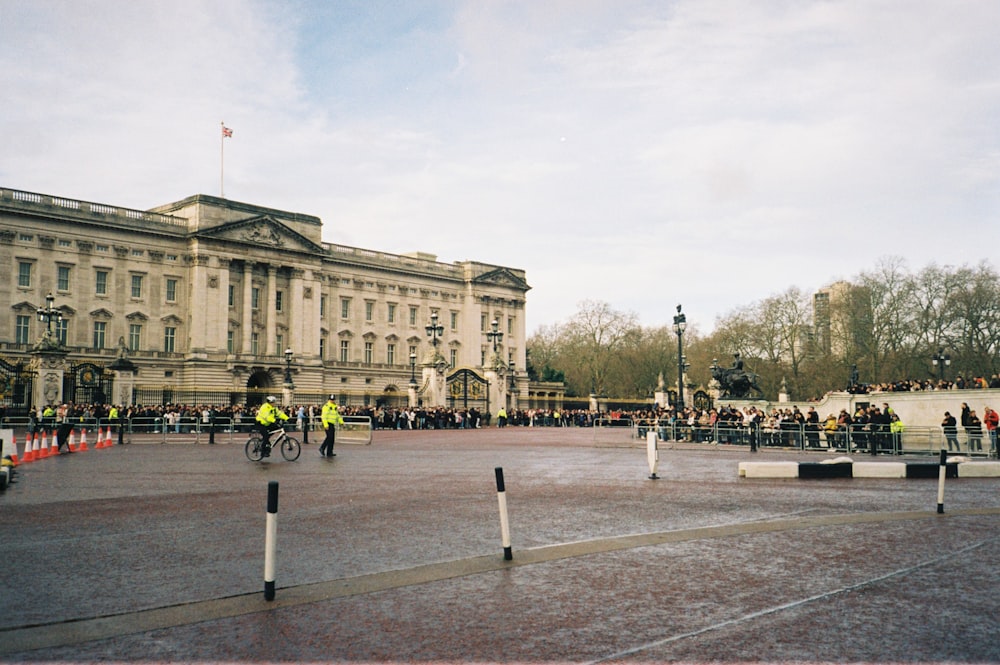 a group of people riding bikes in front of a building