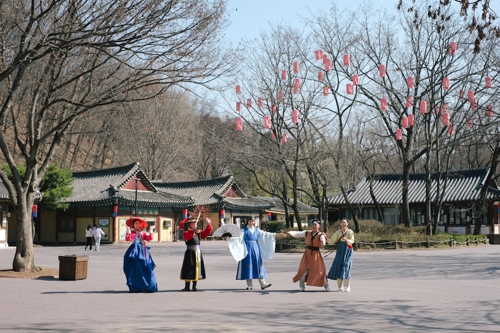 a group of people standing in front of a building