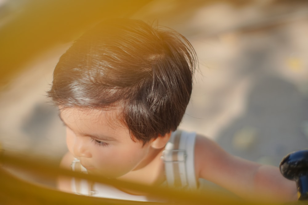 a little boy that is looking at something