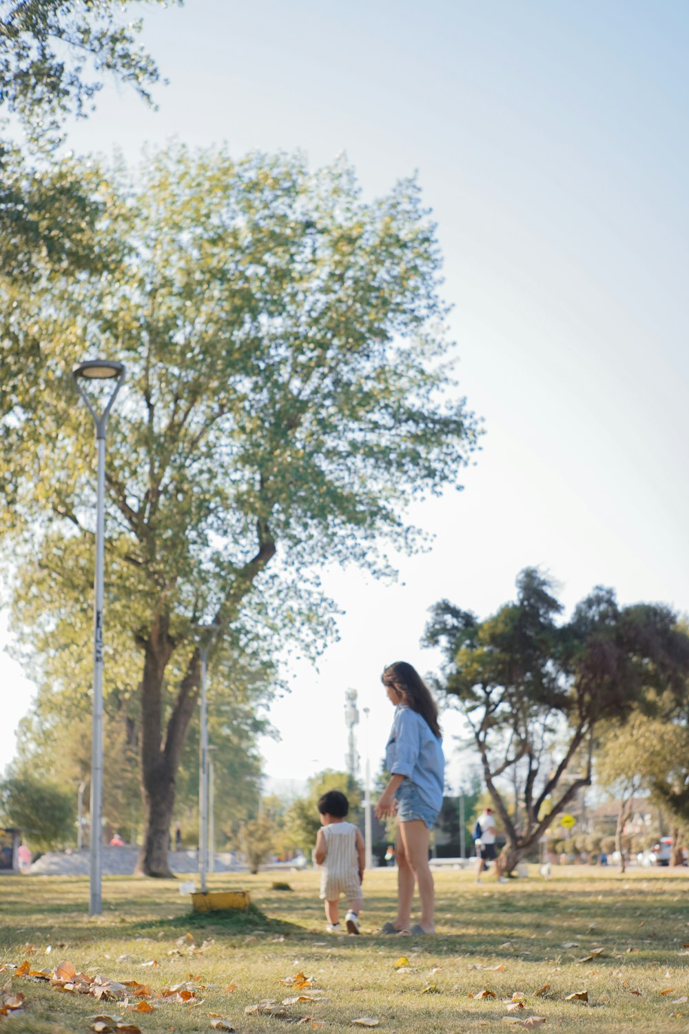 a woman and a child in a park