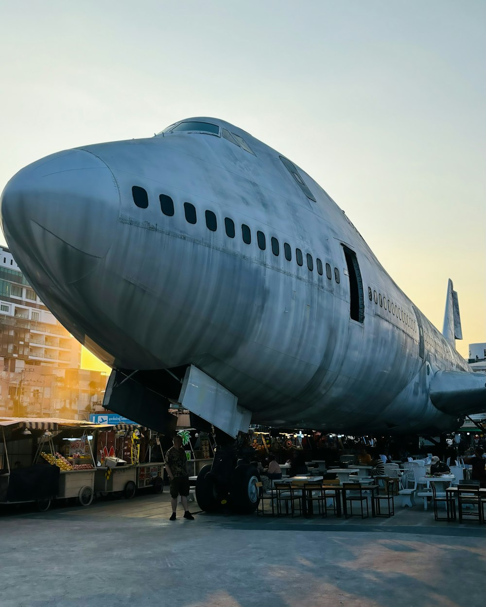 a large jetliner sitting on top of an airport tarmac