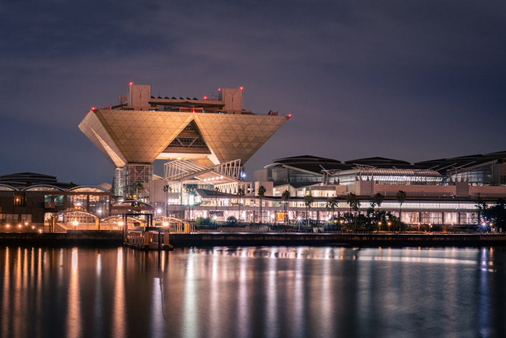 a large building sitting on top of a body of water