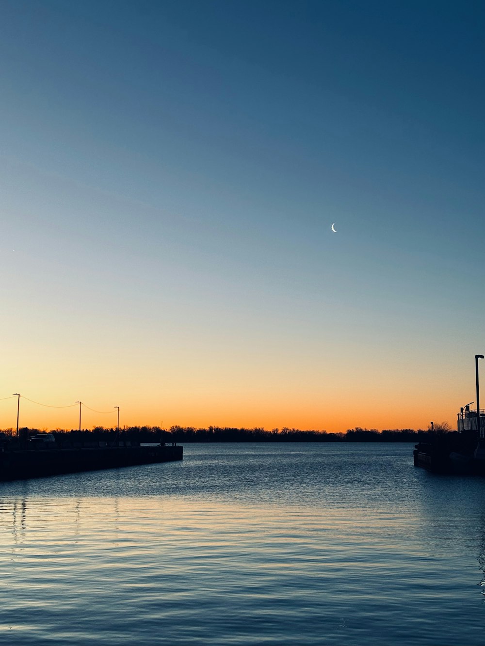 a body of water with a boat in the distance