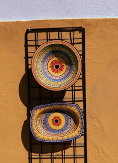 a couple of plates sitting on top of a metal rack