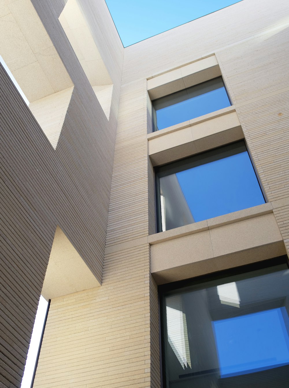 a close up of a building with a clock on the side of it