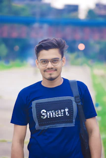 a man wearing a smart t - shirt and carrying a backpack