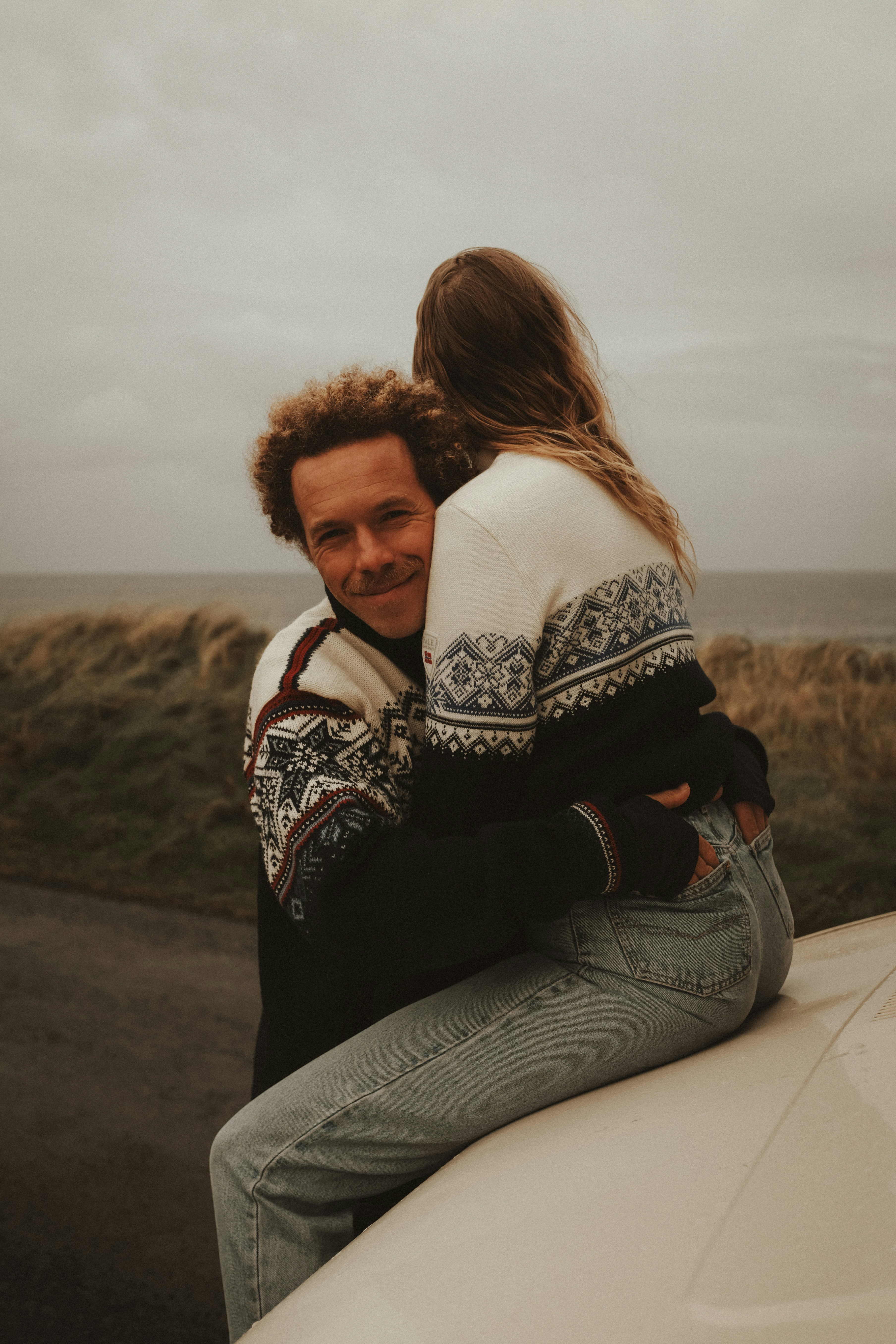 black and brown leather padded tub sofa