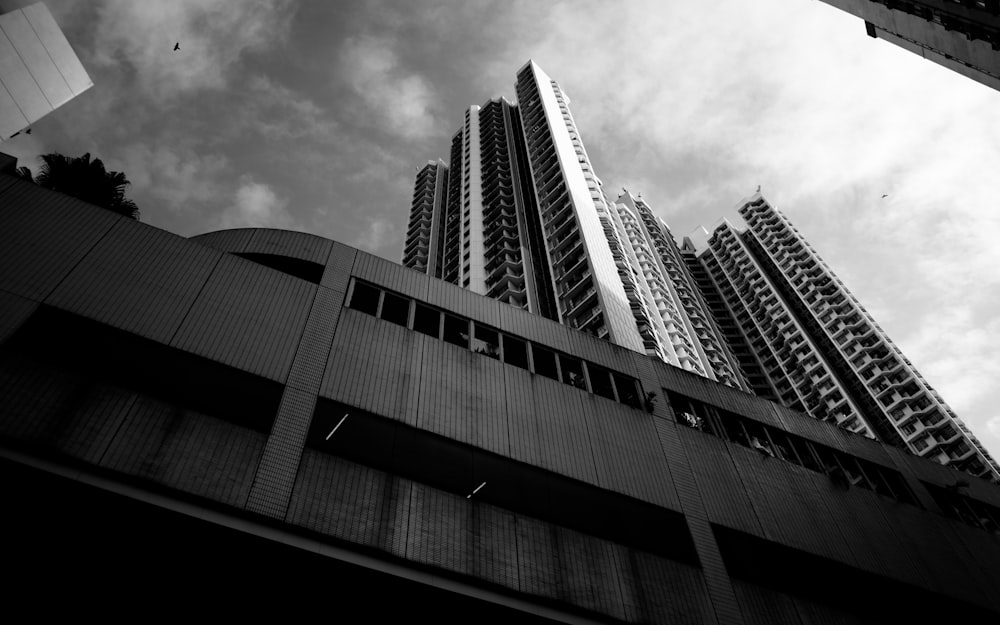 a black and white photo of tall buildings