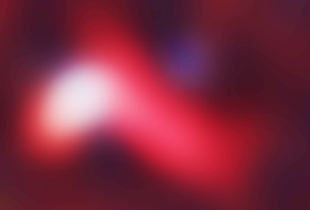 a blurry image of a red and blue background