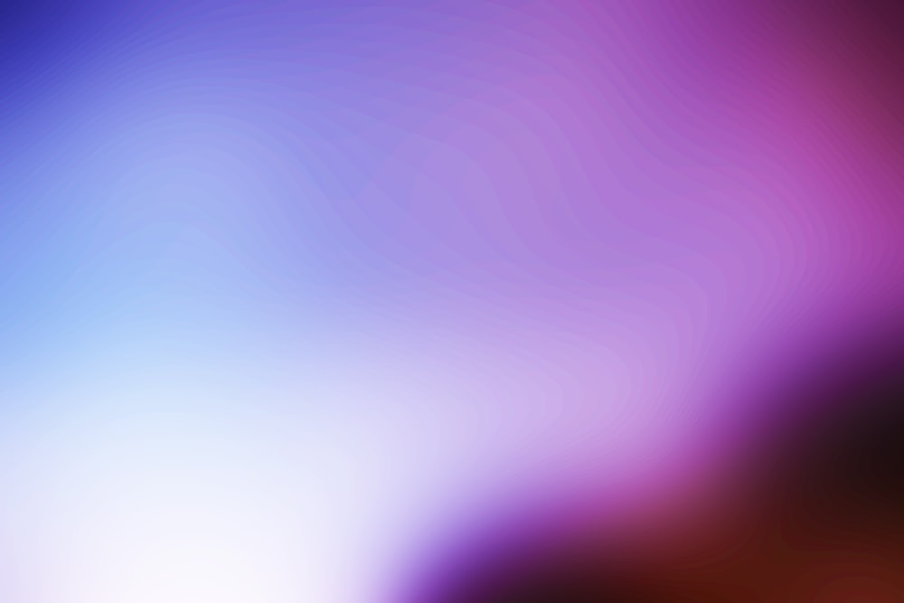 a blurry image of a purple and blue background