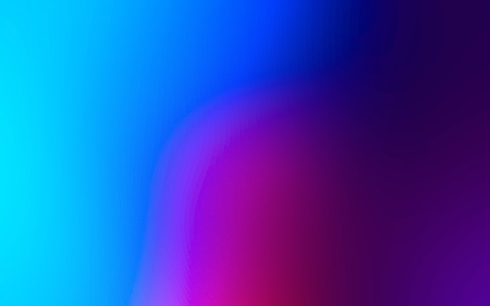 a blurry image of a blue and pink background