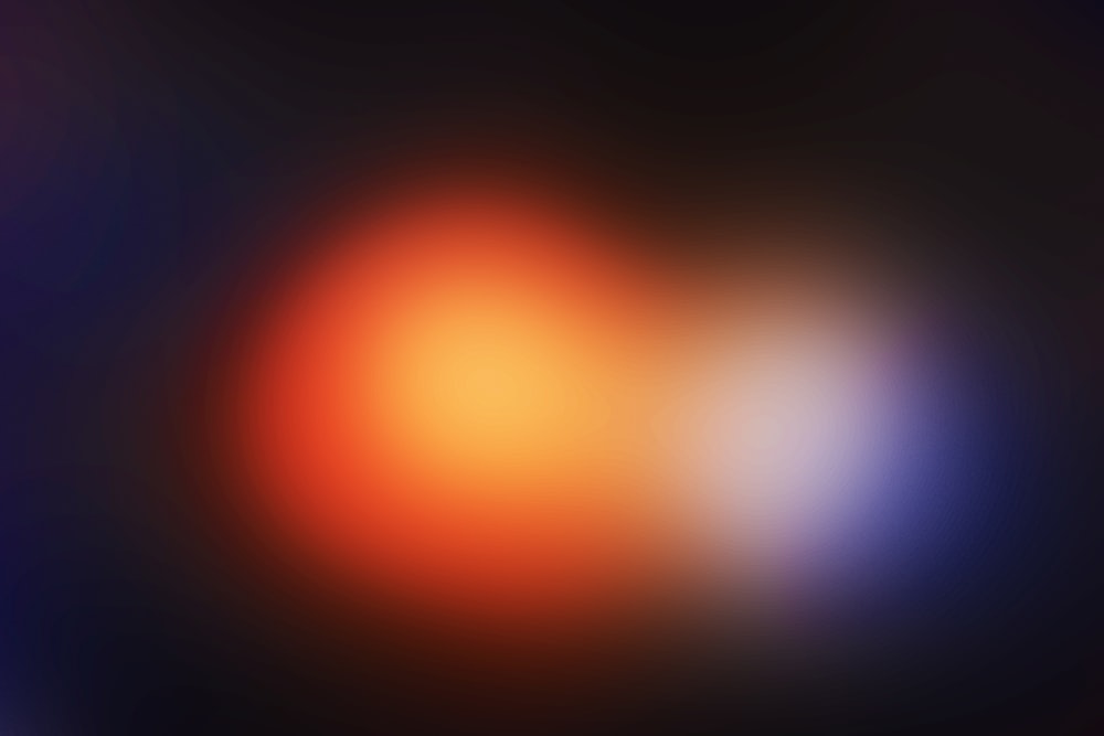 a blurry image of an orange and blue light