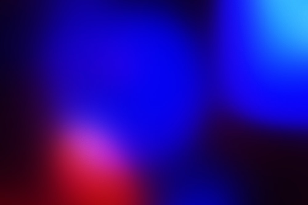 a blurry image of a red and blue background