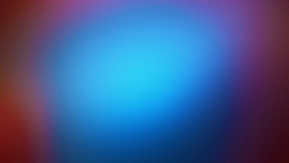 a blurry image of a red and blue background