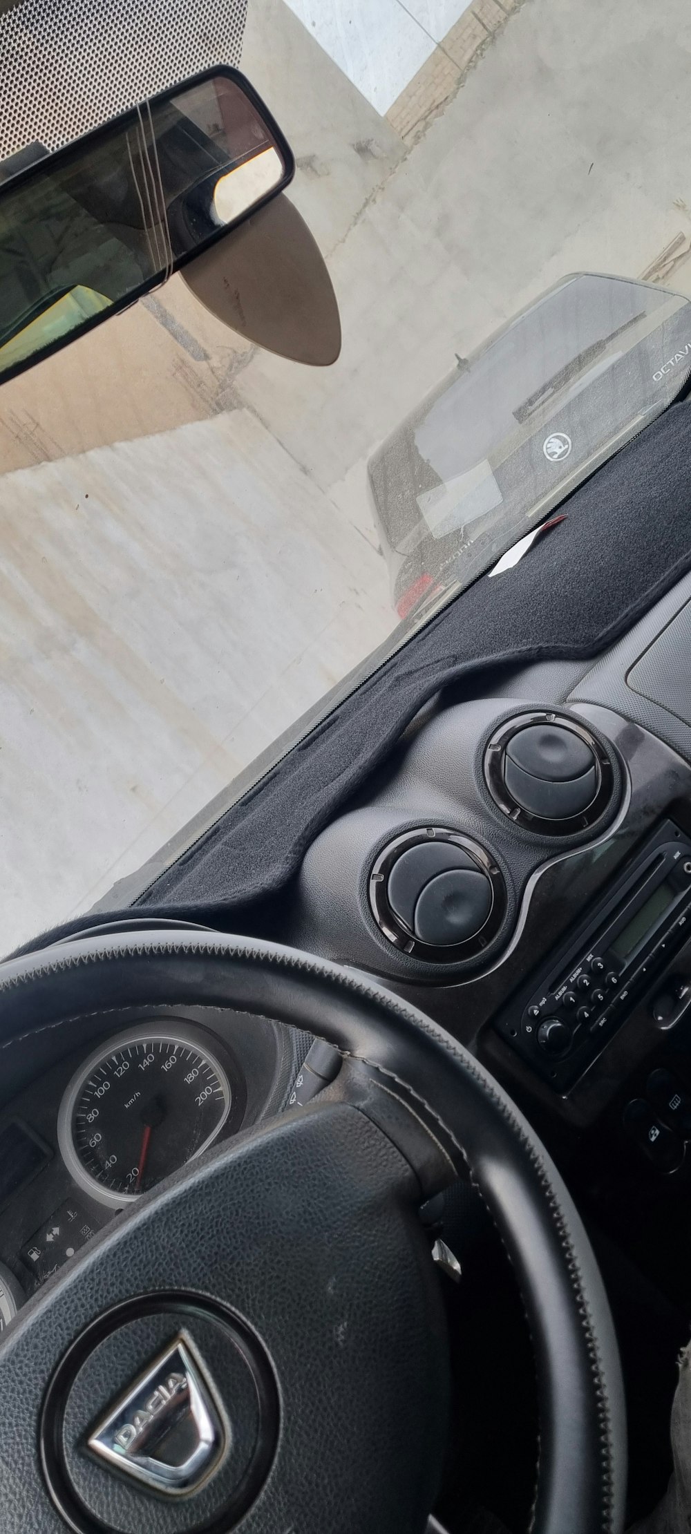 a car dashboard with a dash board and steering wheel