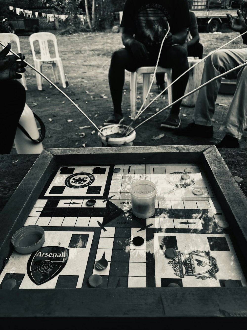 a group of people playing a game of checkers