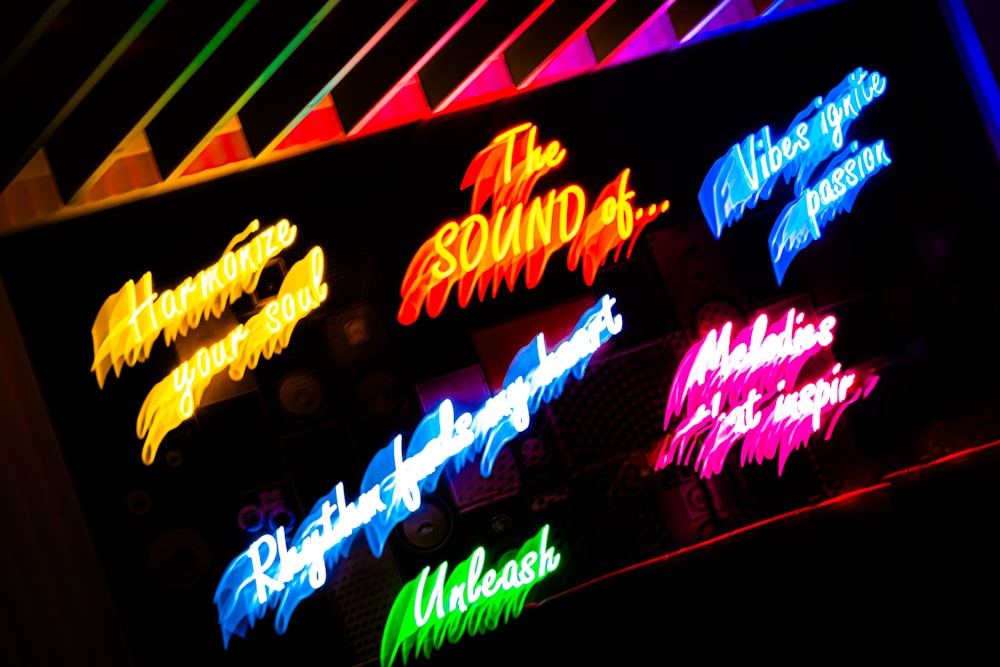 a neon sign is lit up in the dark