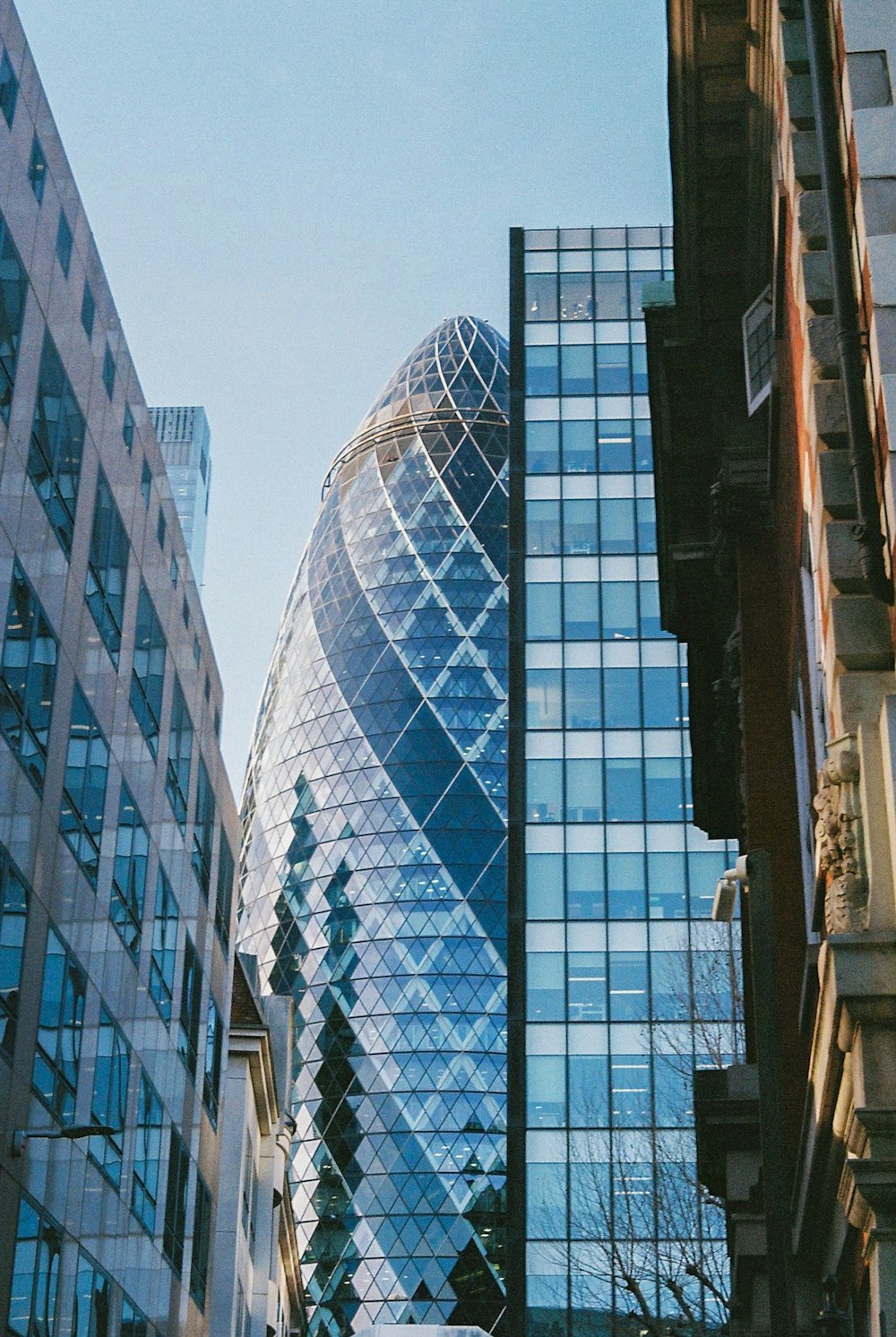 a very tall building next to other tall buildings