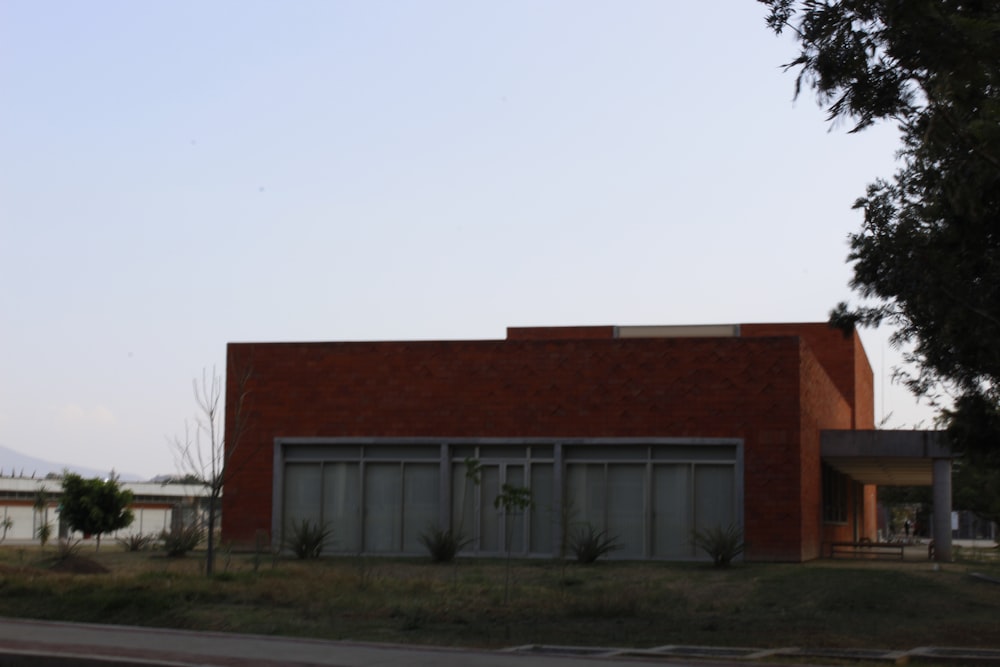 a red brick building sitting on the side of a road