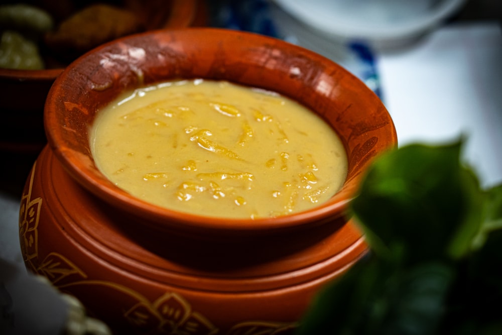 a close up of a bowl of soup on a table