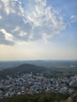 a view of a city from the top of a hill