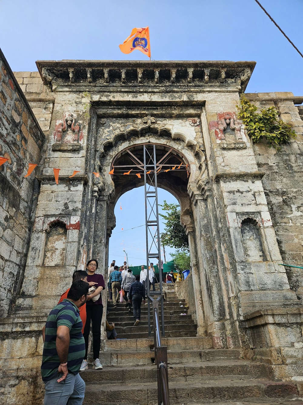 a group of people walking up some stairs